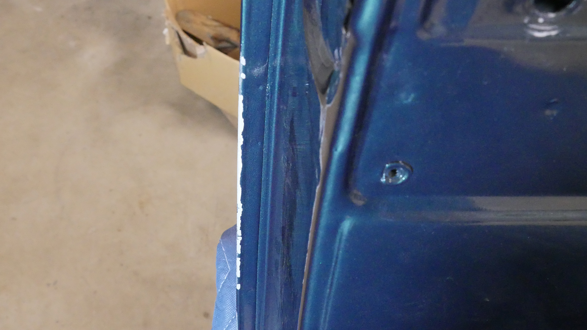 Damaged door paint due to interference with cowl when opening doors. Luckily the cowl can just be polished.