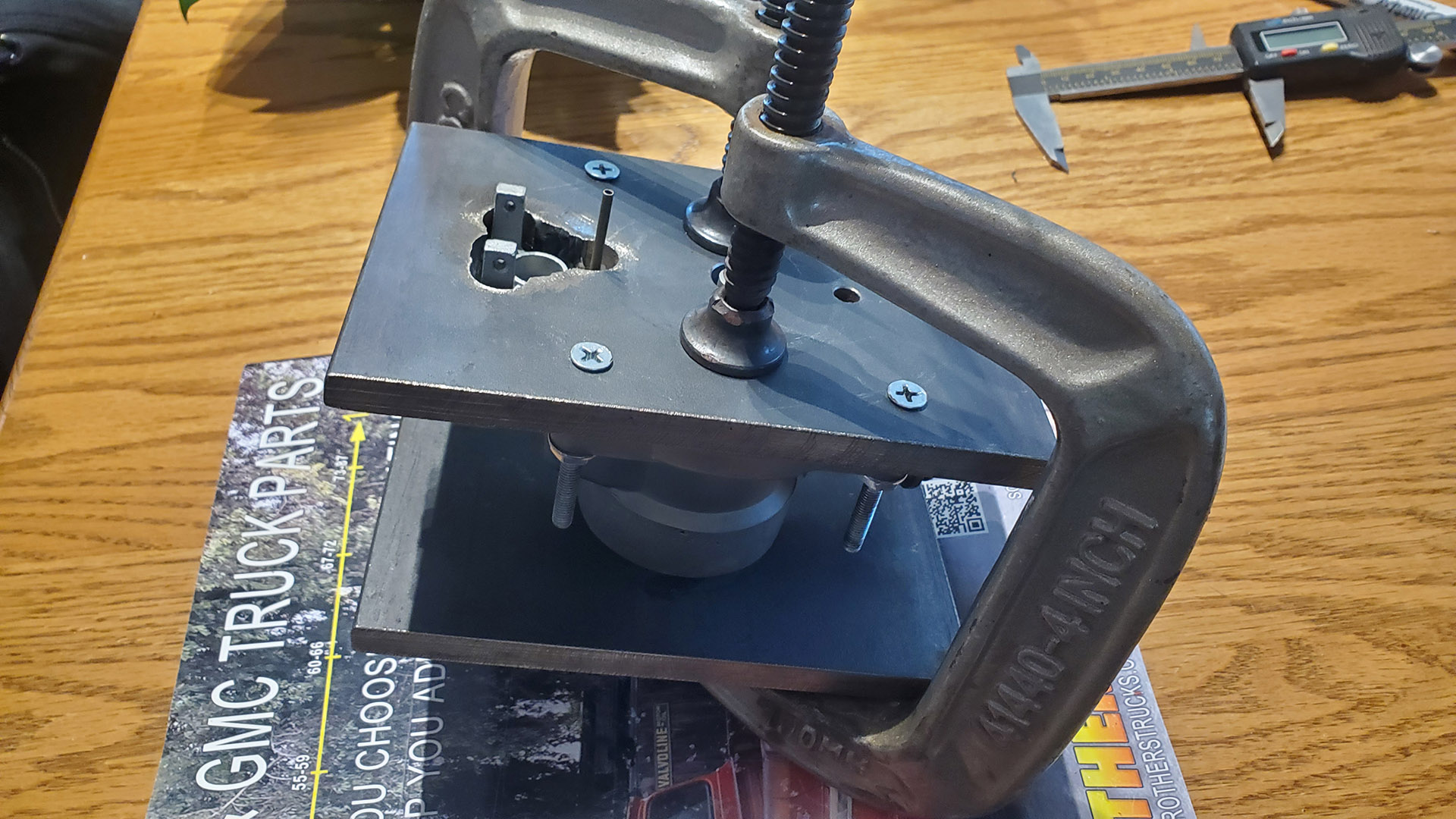 Carb airhorn clamped in straightening jig