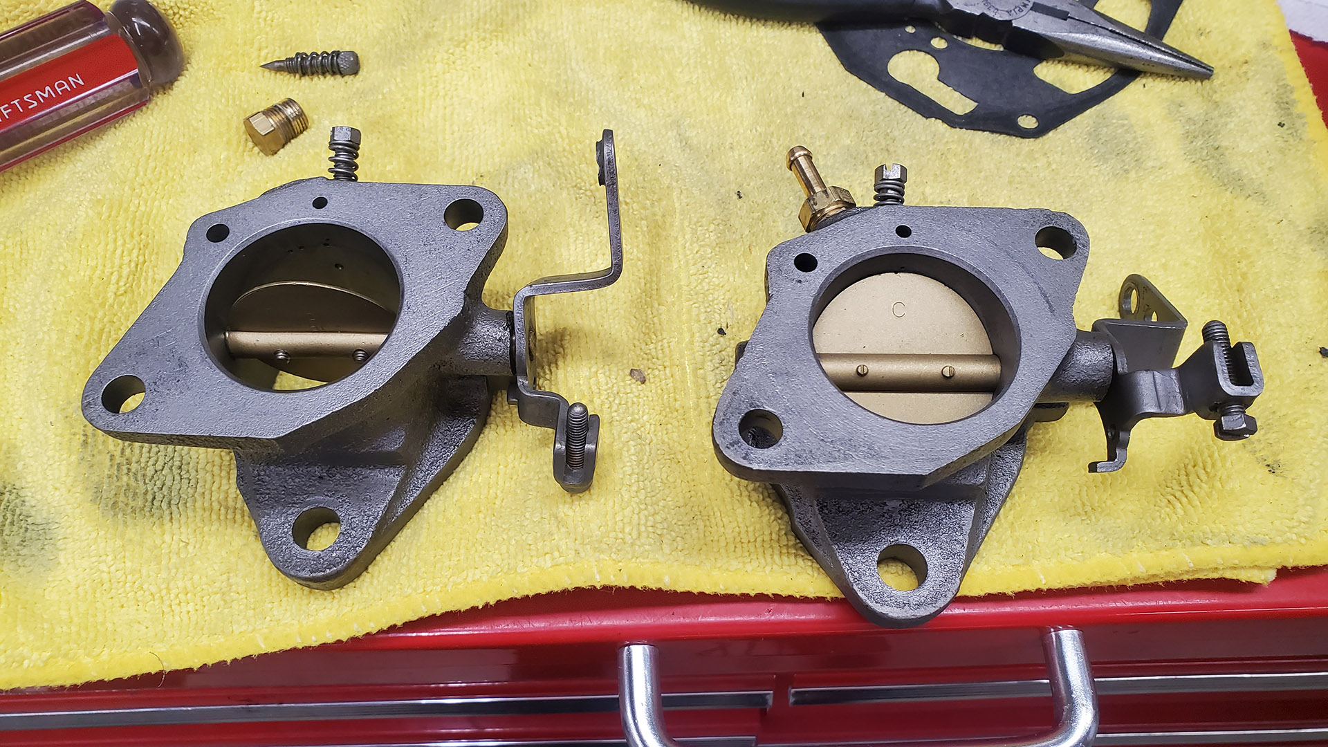 You can't tell from the photo alone, but the throttle body on the left is junk.