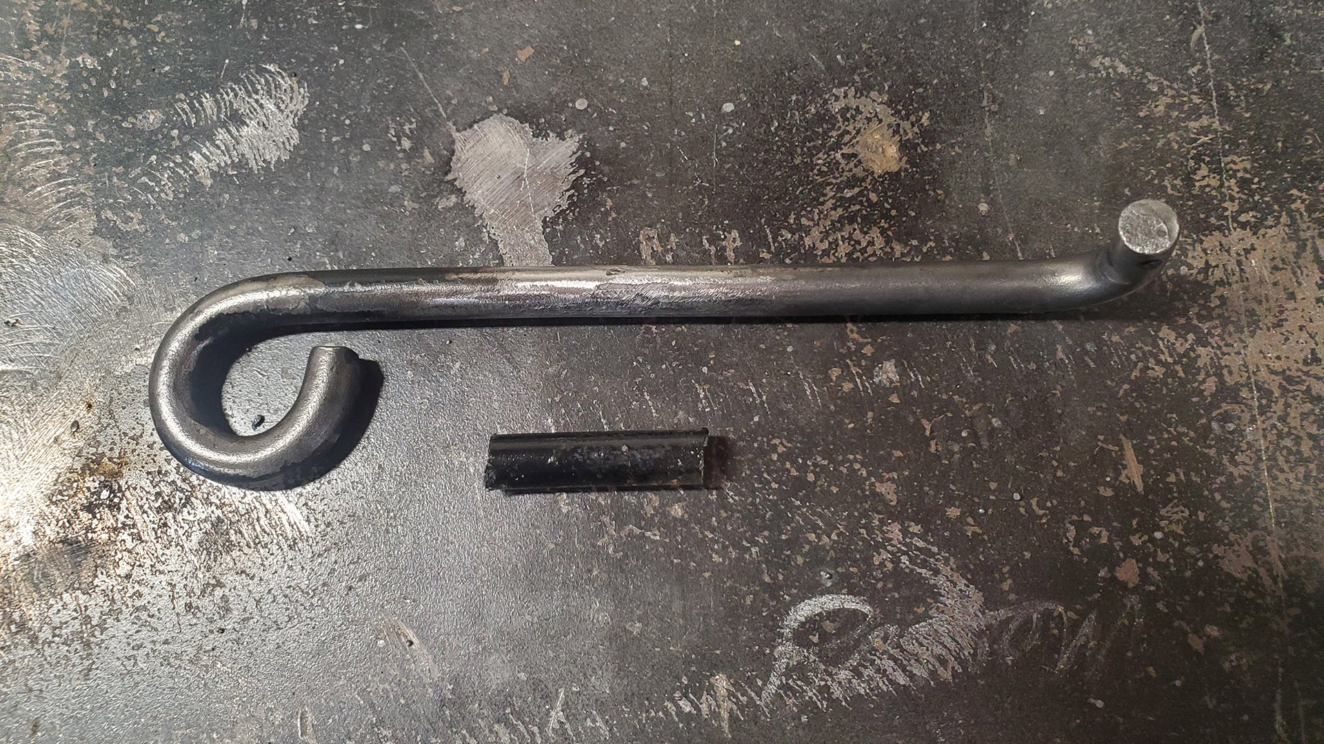 1.25" is cut out of the rod and welded back together