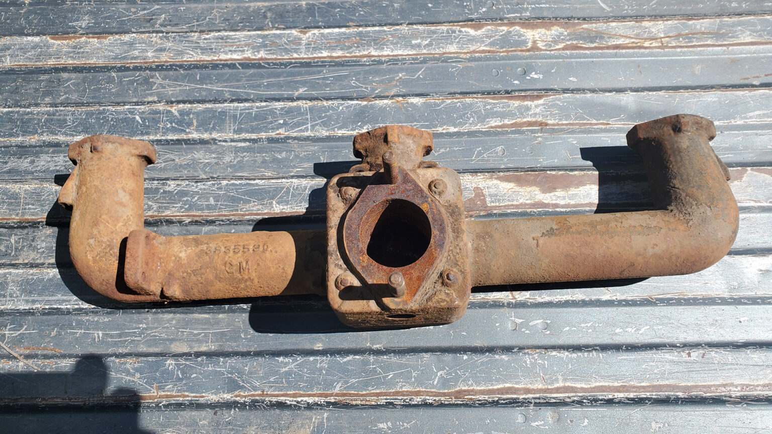 Crusty and rusty manifold before